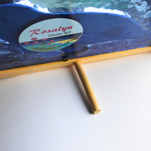 Load image into Gallery viewer, Rosalyn Glass Art product with a blue glass panel and wooden frame on a white surface.